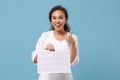 African doctor woman in medical gown showing thumb up hold electro cardiogram heart ekg chart of wave in paperÃÂ isolated